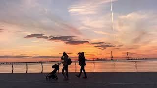 Sunset behind Incheon bridge   with pedestrians, Korea, 20 October 2024