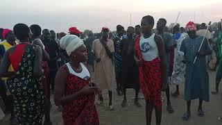 Shabab dancing at Dr. John Garang University of Science and Technology's Field after wrestling.