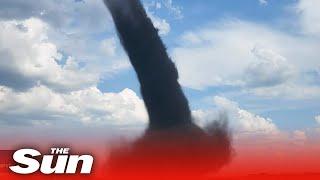 Huge TORNADO rips across farmland in central Alberta, Canada