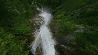 FPV Drone Flys Through Waterfall