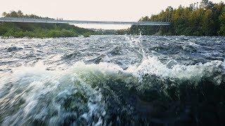 a risky flight on a drone over the water at an extremely low altitude above a stormy river