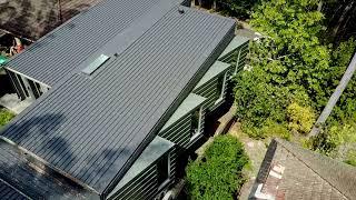 Rheinzink standing seam cladding + Colorbond Klip-lok roofing