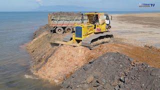 Nice Interested Operators KOMATSU Bulldozers Push Soil Mix Stones Into Sea With Dump Trucks Delivery