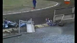 Two Speedway riders crash and knock down barrier