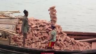 This guy can carry alot of bricks on his head