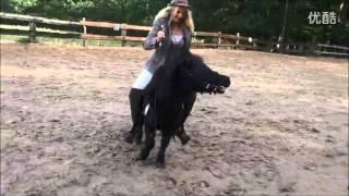 Woman rides tiny pony