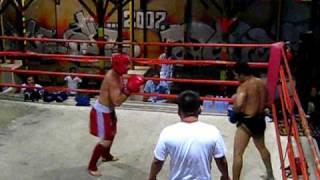 Tourist vs thai boxer fighting in thailand bar round 1