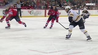 David Pastrnak scores a goal against the New Jersey Devils