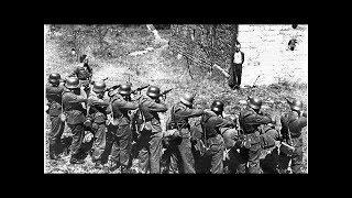 Georges Blind, a member of the French resistance, smiling at a German firing squad, 1944