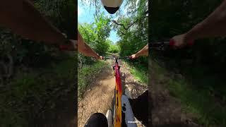 Fast Biker Navigates Mountain Trails Skillfully