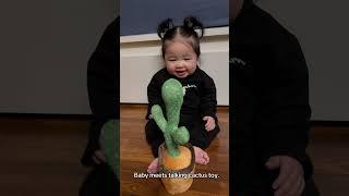 Baby meets talking cactus toy