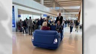 Golf carts to help passengers on long trek through Orlando airport's Terminal C