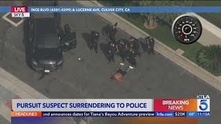 Pursuit suspect surrenders to police