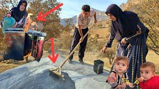 Nargis and the Twins: Spraying tar on the roof of the cottage to protect it from the rain! ️