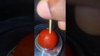 Piercing a cherry tomato with a toothpick #random #randomvideo #shortsfeed #weird #more #foodblog