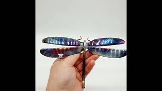 A Heat-painted Dragonfly hand-crafted from recycled cutlery. 