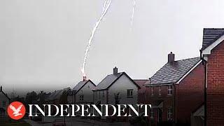 Moment lightning bolt strikes couple's home in Oxfordshire and destroys roof