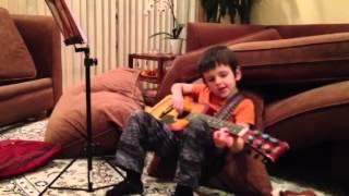 Alex practicing guitar