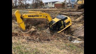 Stuck Trackhoe Excavator Busts Water Main! Worst Driver Ever!