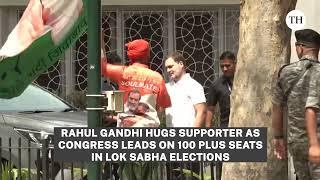 Rahul Gandhi hugs supporter as Congress leads on 100 plus seats