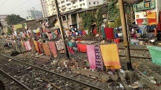 KOLKATA   RAILWAY TRACK GRAB BY THE POOR PEOPLE( INDIAN PEOPLE LIFE WHO LIVES IN RAILWAY TRACK)