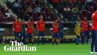 Players protest unpaid wages by standing still in Mexican football match