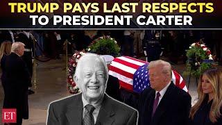 Donald and Melania Trump pay their respects to the late President Jimmy Carter