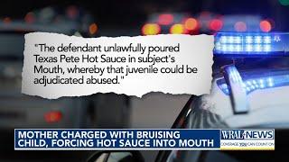 Mother charged with brusing child, pouring hot sauce into mouth