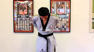 USMAC Instructor showing how to tie your Taekwondo Belt