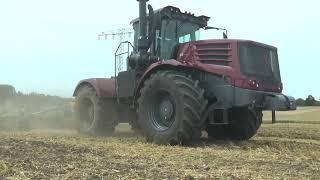 Kirovets K-743 articulated tractor doing field preparation