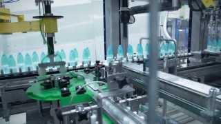 Gravimetric filling of cosmetics in PET bottles integrated into packaging machine from Schubert