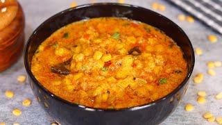 Raw gram tomato curry made with my father-in-law's trademark masa Rice chapati  Chana Dal Curry