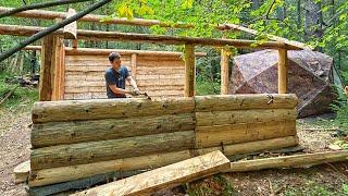 The construction of a log cabin in the wild forest - the construction of walls from an old dugout