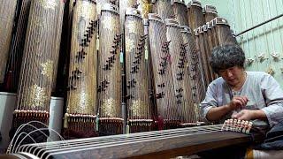 Process of making zither. Korean traditional musical string instruments factory