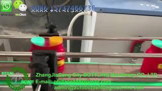 Automatic sleeve labeling machine for shrink biding 2 bottles or cups together