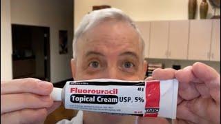 a dermatologist applies fluorouracil cream (Efudex, Efudix)