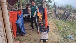 17 year old single mother chops firewood to dry. cleaning up her yard and cooking noodles.