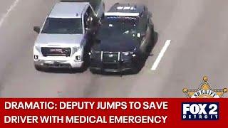 Video shows dramatic rescue on Gratiot with deputy jumping into truck