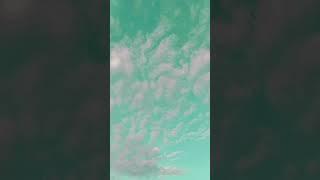 Beneath the sky so wide and high,Dreams take flight as clouds drift by.