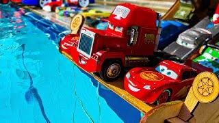 Disney Pixar Cars falling into deep pool, Lightning McQueen, Tow Mater, Mack, Sally, Francesco