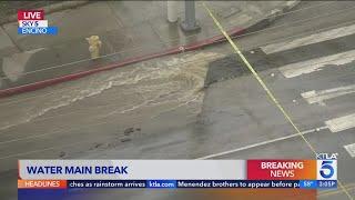 Broken water main floods Encino street