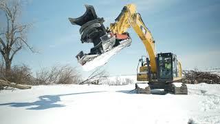 Cat 323F excavator cuts trees with 21" tree shear attachment