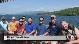 Priests on floating tiki bar rescue man in Lake George