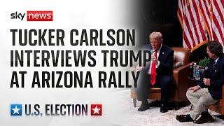 Donald Trump speaks at an event in Arizona with Tucker Carlson and Robert F. Kennedy Jr