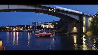 Sailboat lifted by a bridge