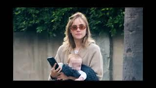 Robert Pattinson's fiancée Suki Waterhouse cradles their baby daughter as she enjoys a stroll in LA