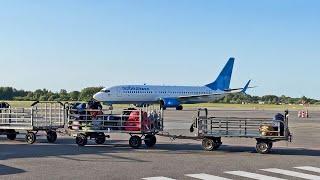 Departure "Pobeda" aircraft  in the rays of the pre-sunset sun from Kaliningrad. May, 2023