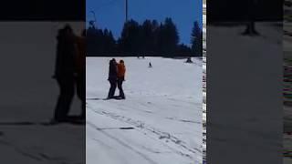 Funny ski lift fail ride on snowboard.