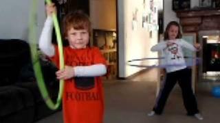 little kids hula hooping to stronger!