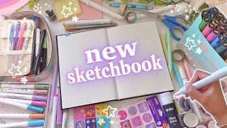 starting & customising my new sketchbook  drawing on the cover, first page & more!